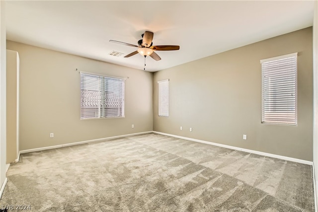 unfurnished room with carpet floors and ceiling fan