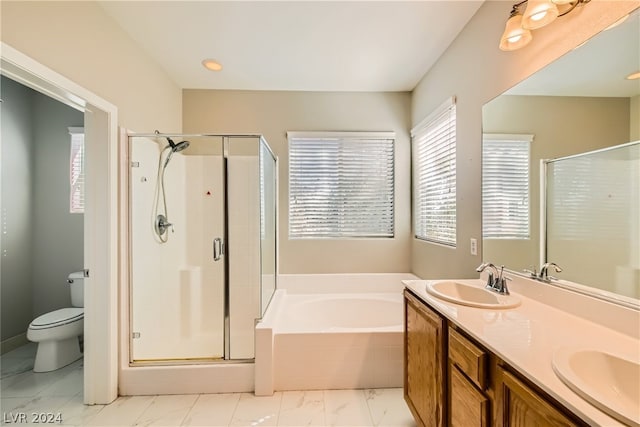 full bathroom with tile flooring, double sink, separate shower and tub, large vanity, and toilet