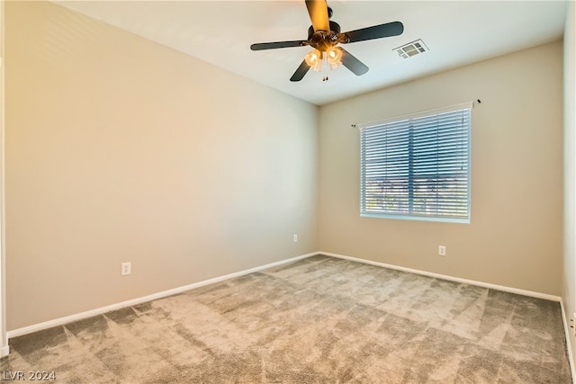 carpeted empty room with ceiling fan