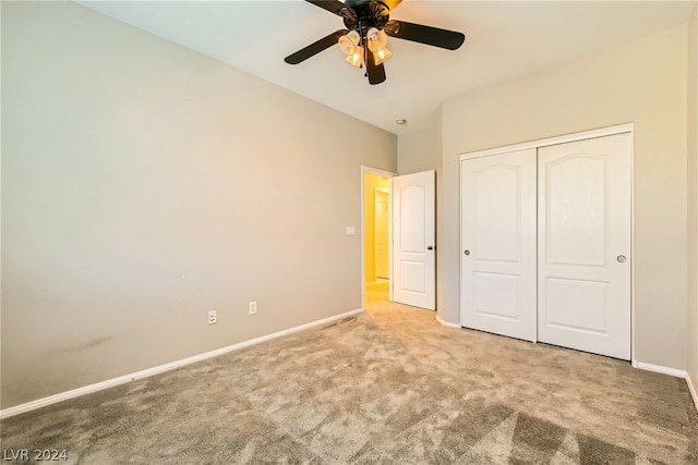 unfurnished bedroom featuring a closet, carpet, and ceiling fan