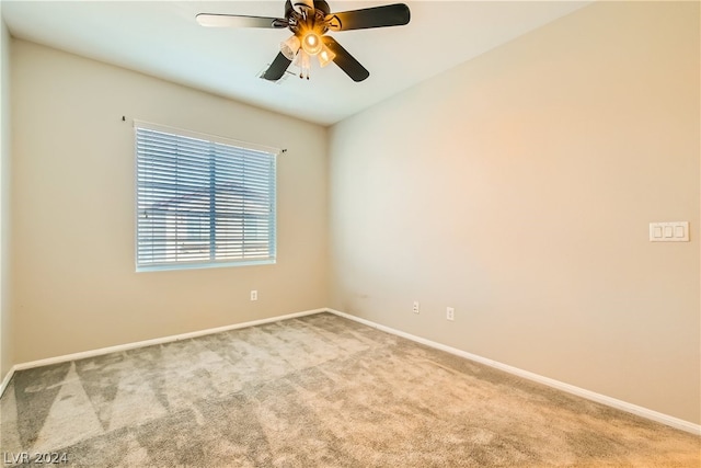 spare room featuring carpet and ceiling fan