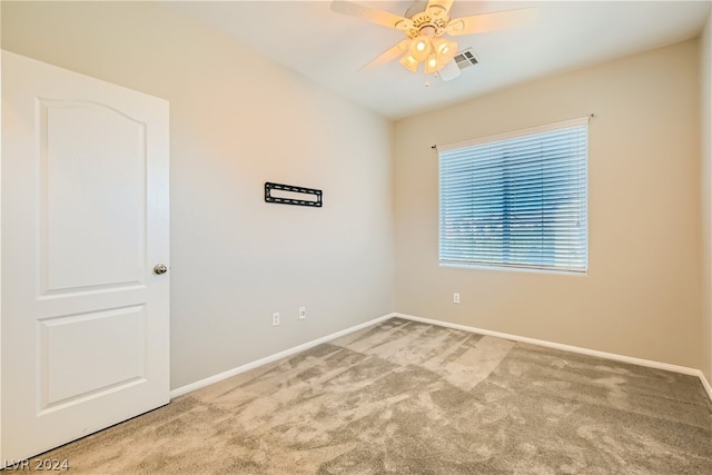 empty room with carpet floors and ceiling fan