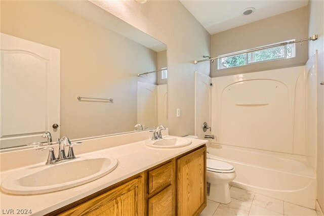 full bathroom with toilet, tile floors, bathtub / shower combination, and double sink vanity