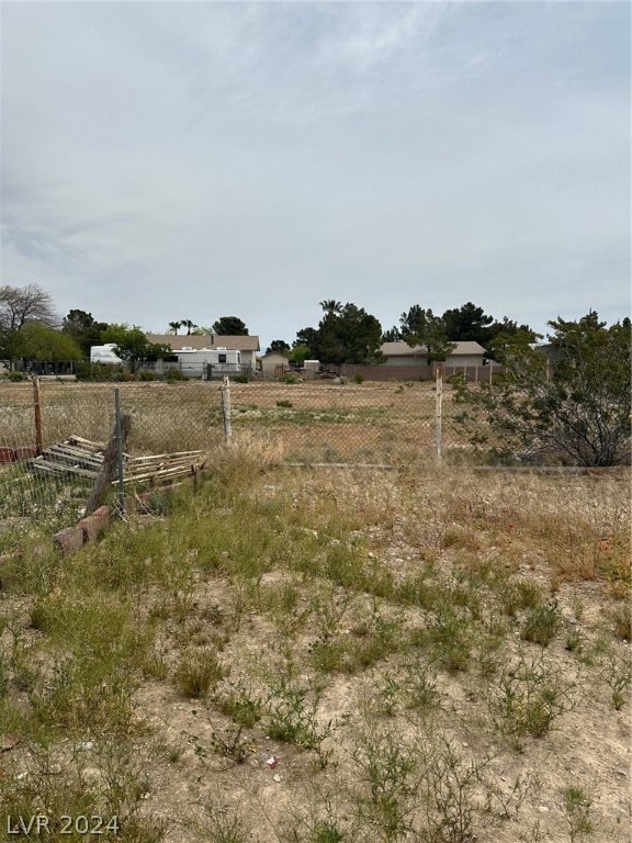 view of yard with a rural view