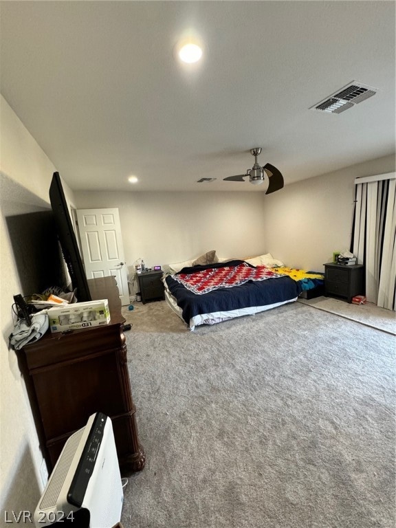 bedroom with ceiling fan and carpet flooring