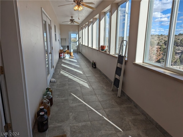 interior space featuring ceiling fan