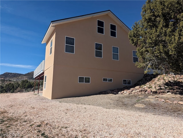 view of home's exterior with a mountain view