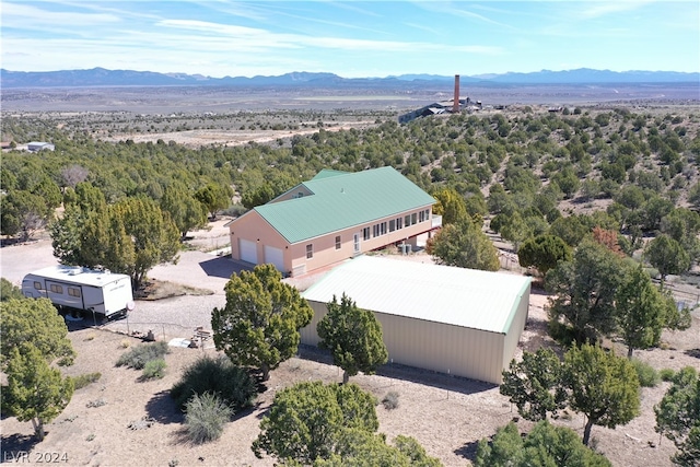 birds eye view of property with a mountain view