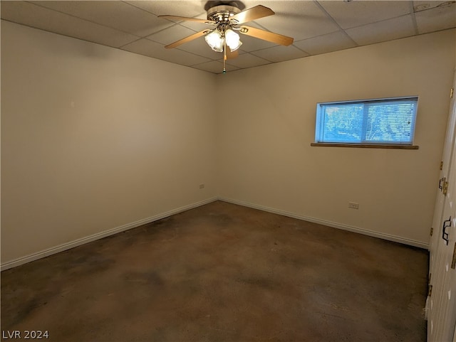 spare room featuring ceiling fan and a paneled ceiling