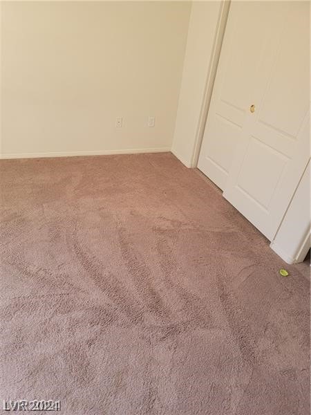 unfurnished bedroom featuring dark carpet