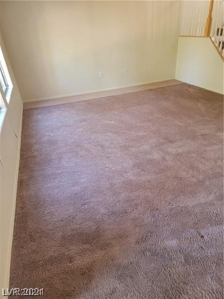 unfurnished room featuring carpet flooring