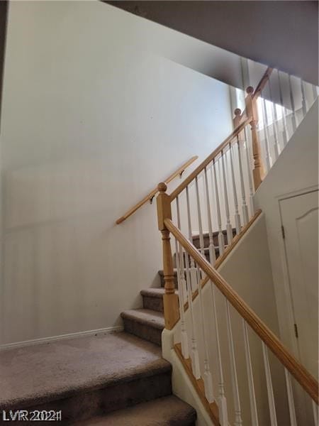 staircase with carpet floors