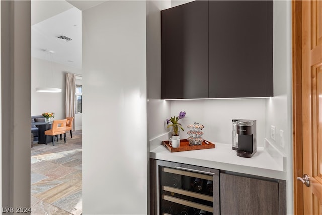 bar featuring tile floors and beverage cooler