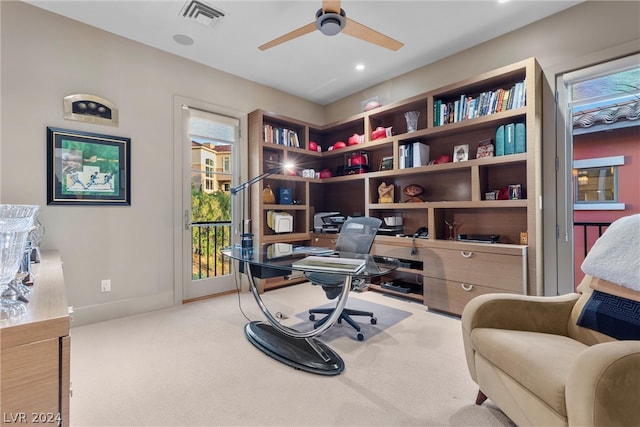 office with light colored carpet and ceiling fan