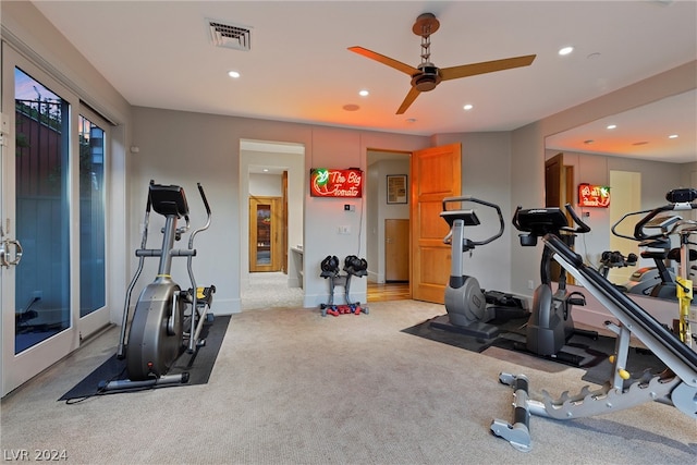 workout area with light carpet and ceiling fan