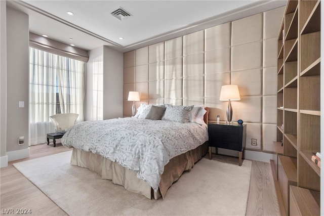 bedroom with hardwood / wood-style flooring