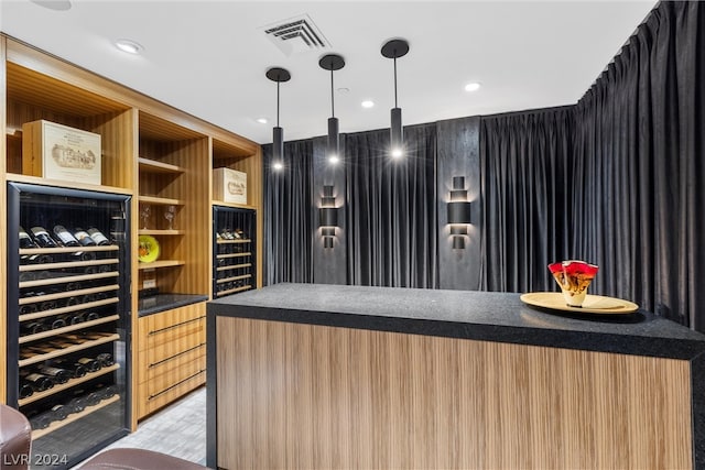 interior space with light wood-type flooring and bar