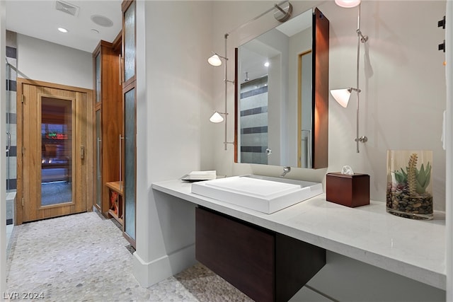 bathroom with tile flooring and oversized vanity