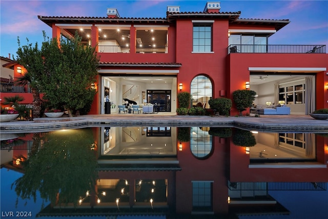 view of front of home featuring a balcony