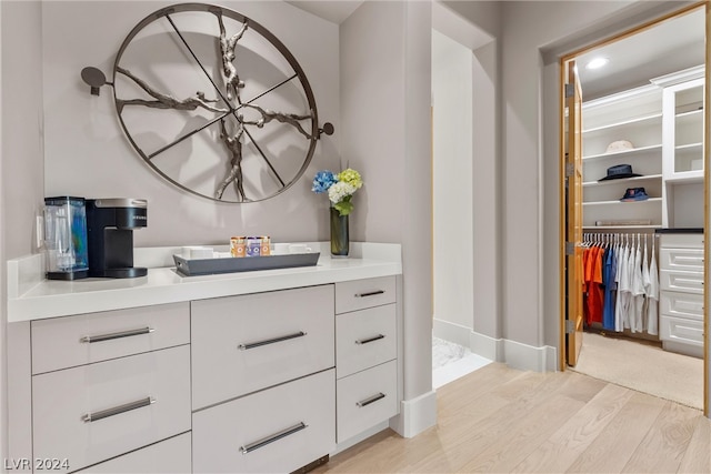 bathroom with vanity and hardwood / wood-style floors