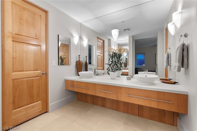 bathroom featuring tile floors and double sink vanity