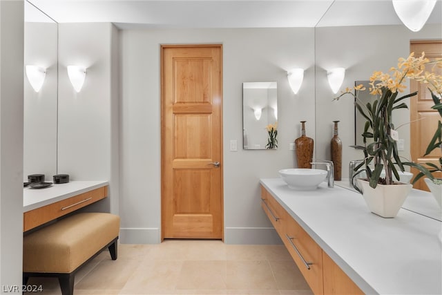 bathroom with tile flooring and large vanity