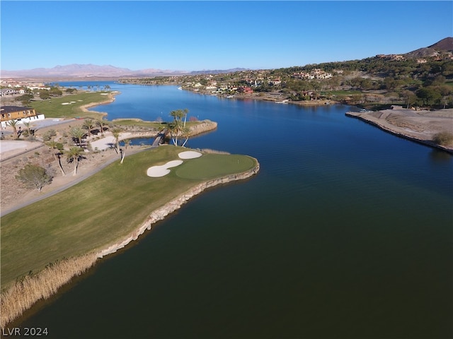 birds eye view of property with a water and mountain view