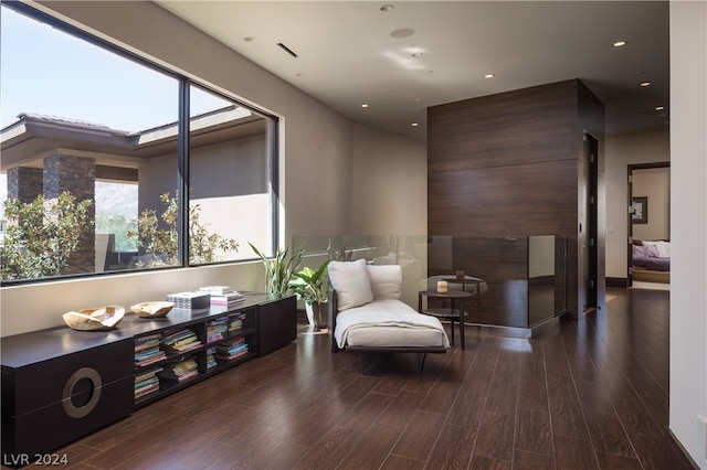 sitting room with wood-type flooring