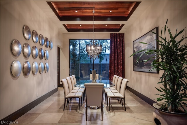 dining area with tile floors and an inviting chandelier