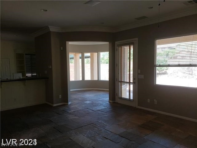 interior space with crown molding