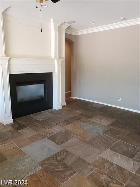 room details featuring crown molding and ceiling fan