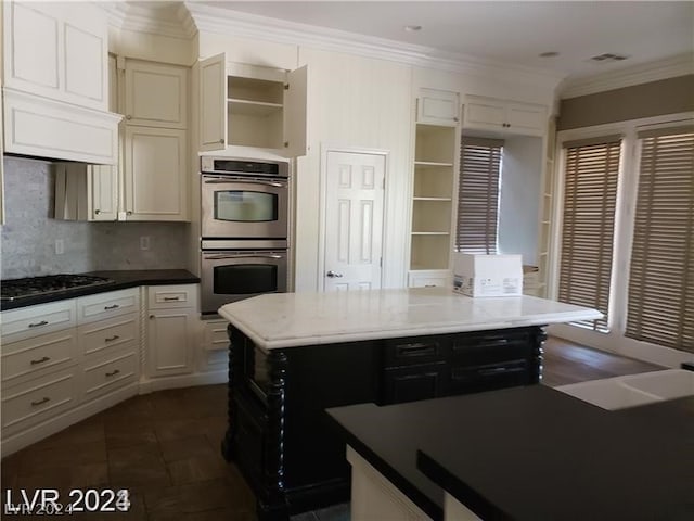 kitchen featuring premium range hood, tasteful backsplash, ornamental molding, a center island, and stainless steel appliances