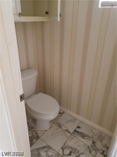 bathroom featuring toilet