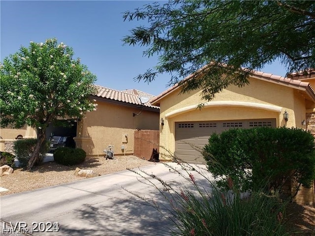 view of front of home with a garage