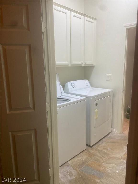 laundry area featuring cabinets and independent washer and dryer