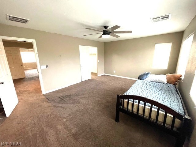 bedroom featuring dark colored carpet and ceiling fan