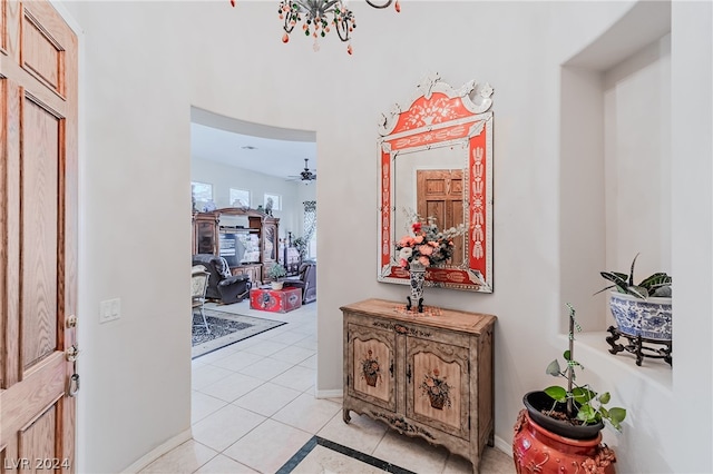 hall featuring light tile patterned flooring