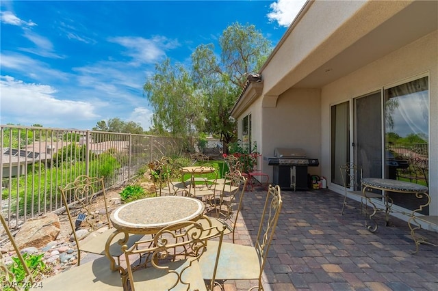 view of patio / terrace featuring outdoor dining area, a fenced backyard, and area for grilling