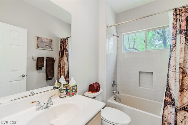 full bath with toilet, shower / tub combo, and vanity