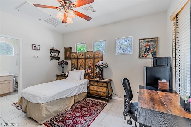 bedroom with light tile patterned flooring, visible vents, and multiple windows