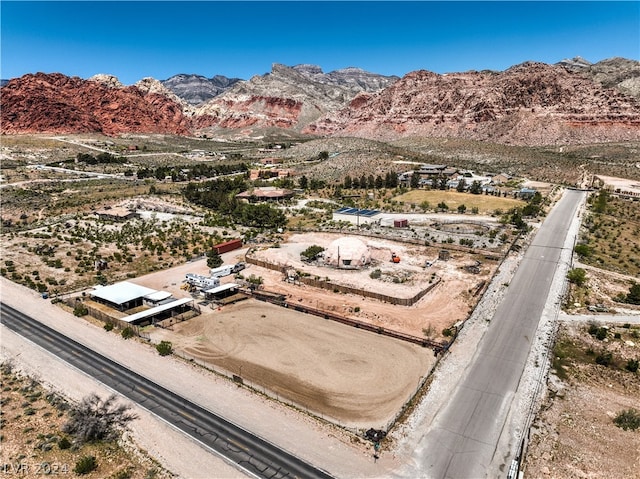 birds eye view of property featuring a mountain view