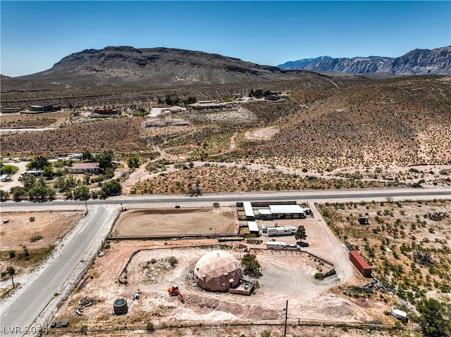 birds eye view of property with a mountain view