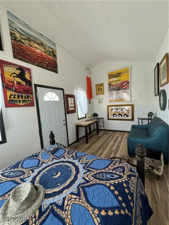 bedroom featuring lofted ceiling and wood-type flooring