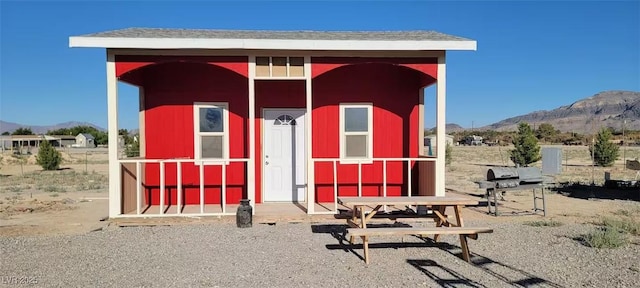 view of outdoor structure featuring a mountain view