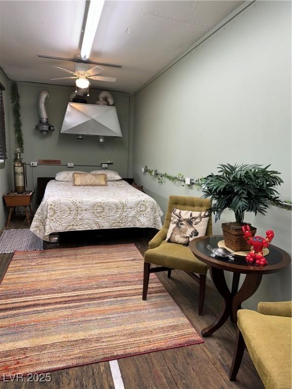 bedroom featuring ceiling fan and wood-type flooring