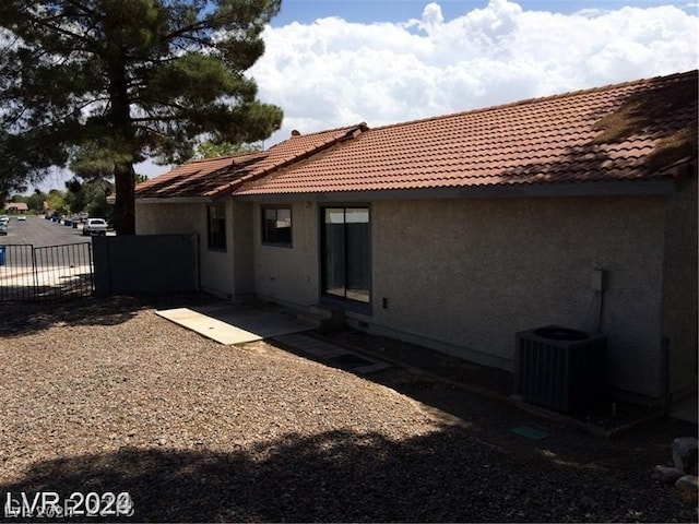 back of property with central AC unit