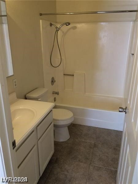 full bathroom with tile floors, toilet, bathtub / shower combination, and vanity