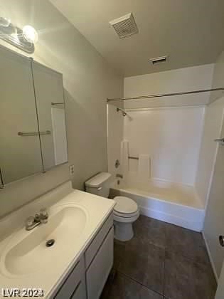 full bathroom with tile floors, toilet, shower / bathing tub combination, and vanity