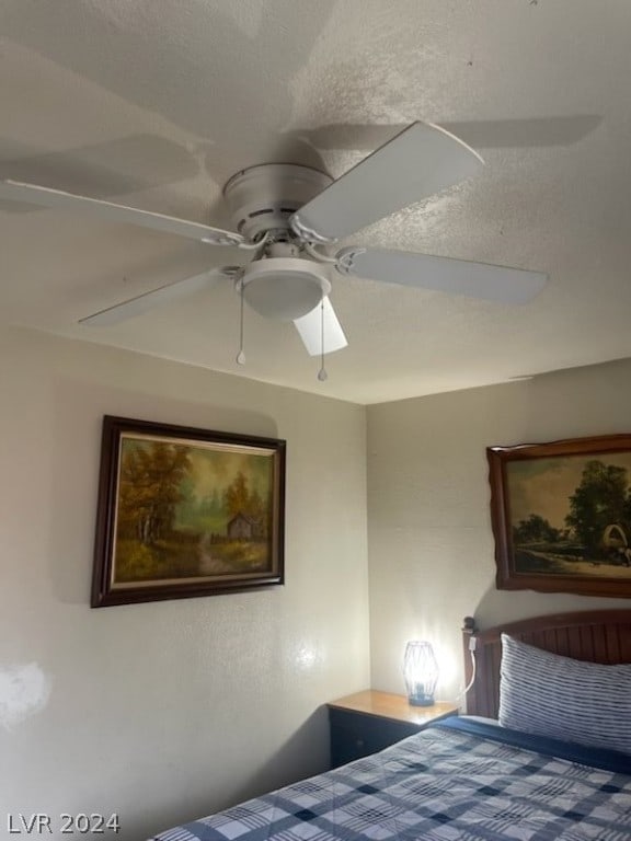 bedroom featuring ceiling fan