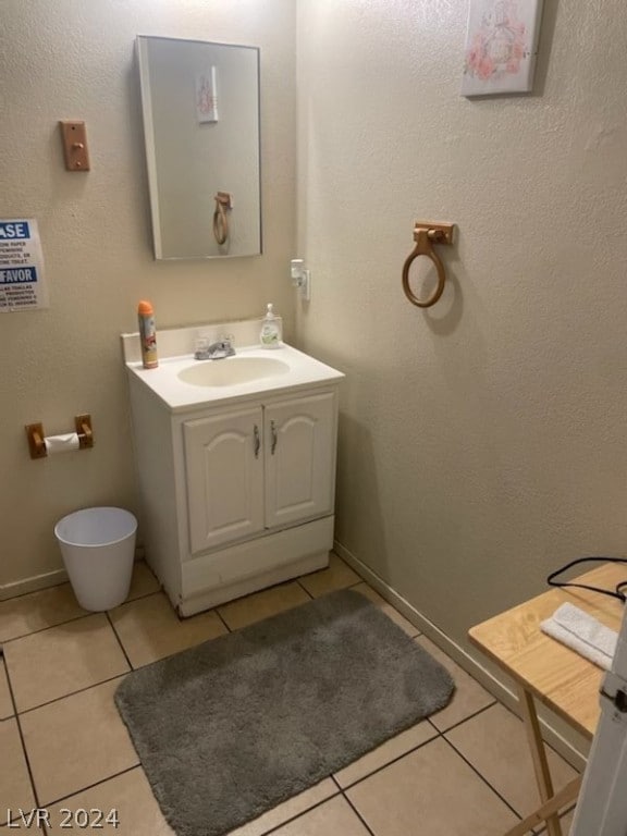 bathroom with vanity and tile floors